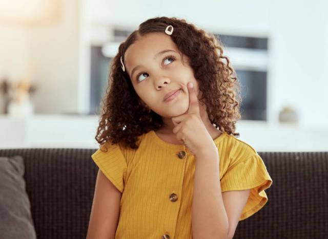 Adorable little child practicing her spatial visualization skills