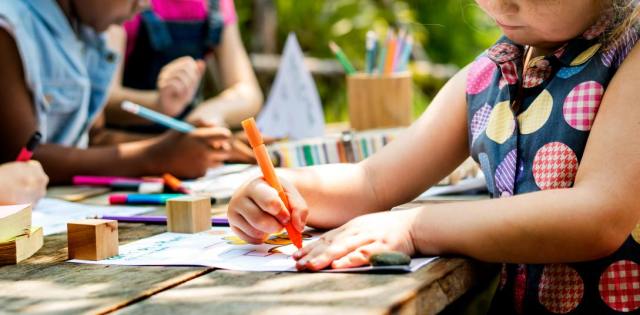 Group of kindergarten kids friends drawing to improve their spatial visualization skills