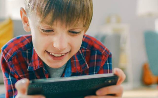 child plays good educational game learning app and spend great time completing games
