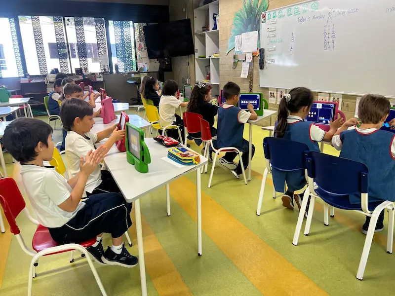 Whole class of children each using individual tablets for independent Magrid visual cognitive learning in school